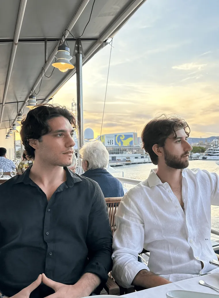Federico Donatone and Lorenzo Asnaghi at a waterfront restaurant